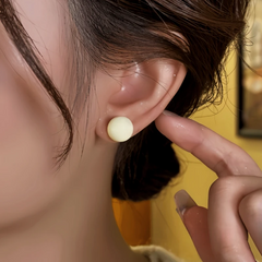 Close-up detail of the sparkling zircons and plating on the Bead Stud Earrings