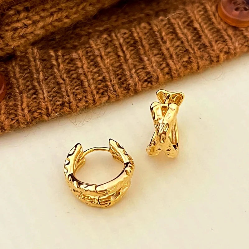 Angled view of the 14K Gold-Plated Elegant Cross-Gold Textured Earrings