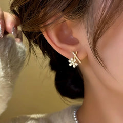 Close-up detail of the sparkling zircons and plating on the Flower Stud Earrings