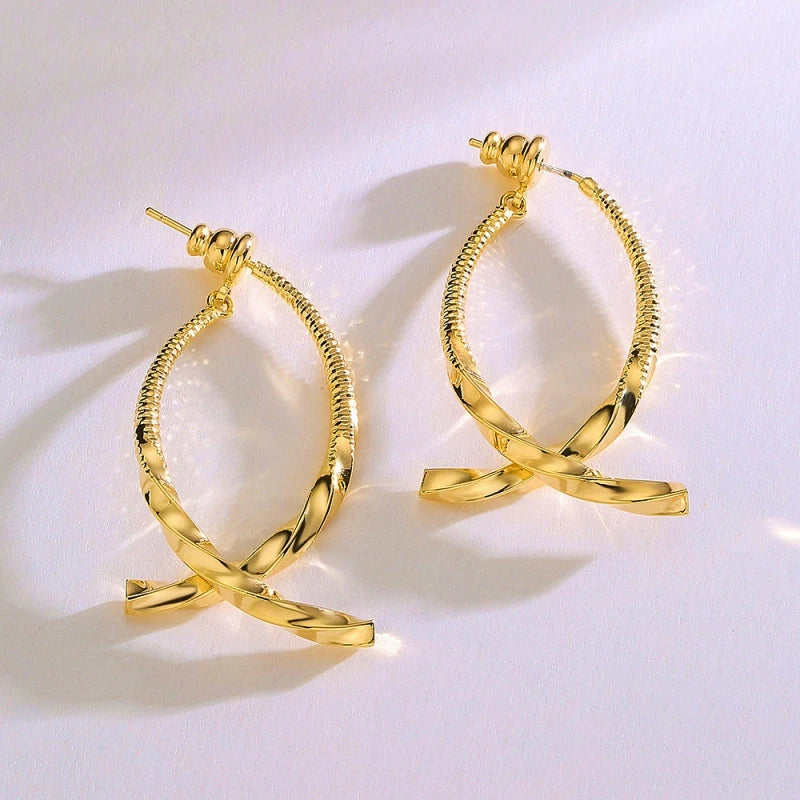 Close-up detail of the sparkling zircons and plating on the Cross Earrings