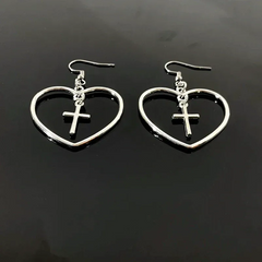 Model showcasing the dangle and style of the 14K Gold-Plated Elegant Cross Heart Ear Hook Earrings