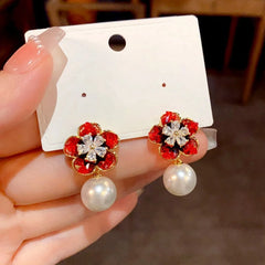 Angled view of the 14K Gold-Plated Elegant Crystal Flower Pearl Earrings