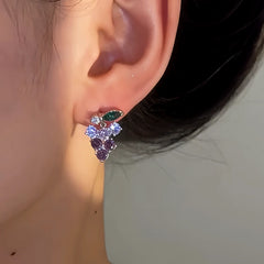 Model showcasing the dangle and style of the 14K Gold-Plated Elegant Crystal Grape Earrings