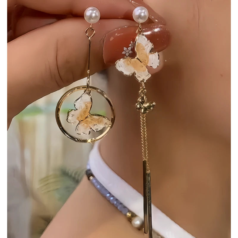 Angled view of the 14K Gold-Plated Elegant Crytsal Butterfly Tassel Earrings