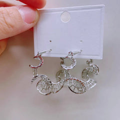 Close-up detail of the sparkling zircons and plating on the Lace Hoop Earrings