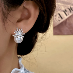 Model showcasing the dangle and style of the 14K Gold-Plated Elegant Daisy Petal Bead Earrings