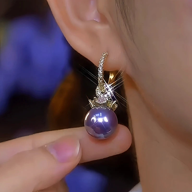 Close-up detail of the sparkling zircons and plating on the Purple Pearl Earrings