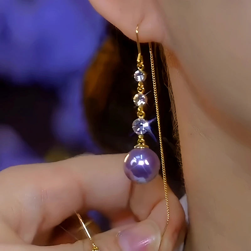 Close-up detail of the sparkling zircons and plating on the Pearl Threader Earrings