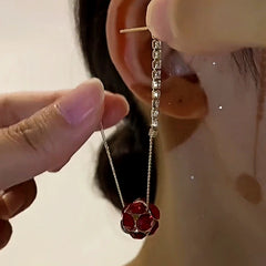 Model showcasing the dangle and style of the 14K Gold-Plated Elegant Diamond Ball Tassel Earrings