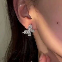 Model showcasing the dangle and style of the 14K Gold-Plated Elegant Diamond Butterfly Earrings