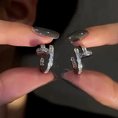 Model showcasing the dangle and style of the 14K Gold-Plated Elegant Diamond C-Ring Earrings