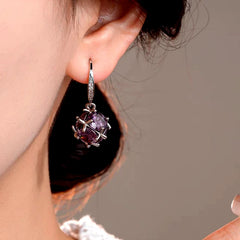 Model showcasing the dangle and style of the 14K Gold-Plated Elegant Diamond Ear Hook Earrings