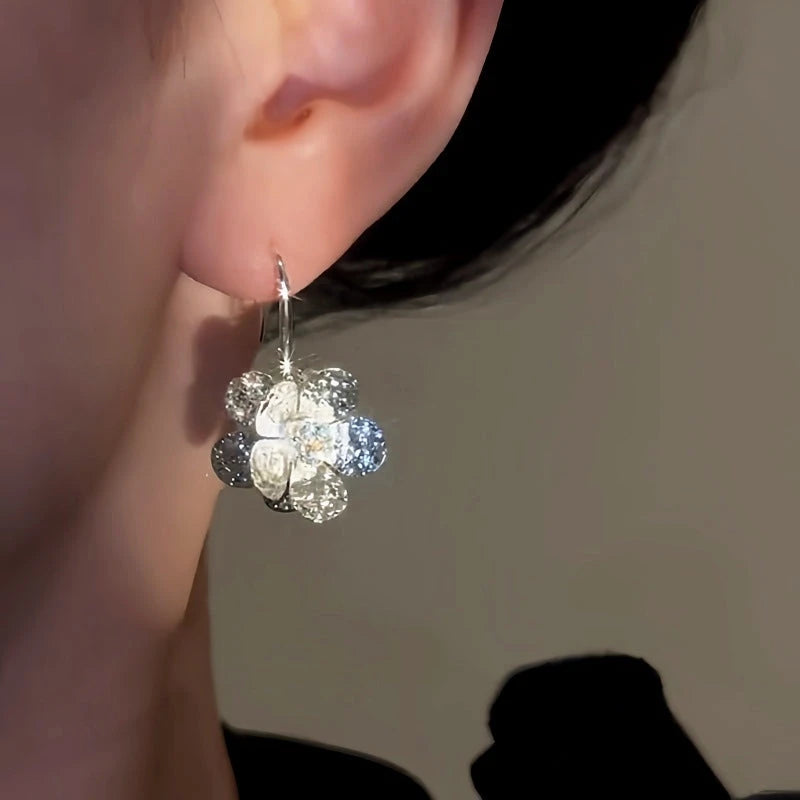 Close-up detail of the sparkling zircons and plating on the Flower Ear Hooks