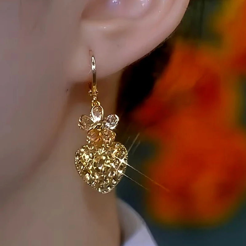 Close-up detail of the sparkling zircons and plating on the Flower Heart Earrings