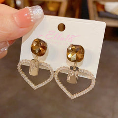 Angled view of the 14K Gold-Plated Elegant Diamond Heart Earrings