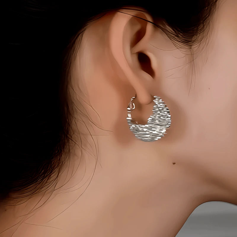 Close-up detail of the sparkling zircons and plating on the Bag Earrings