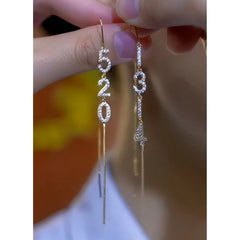 Close-up detail of the sparkling zircons and plating on the Threader Tassel Earrings