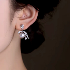 Close-up detail of the sparkling zircons and plating on the Ribbon Pearl Earrings