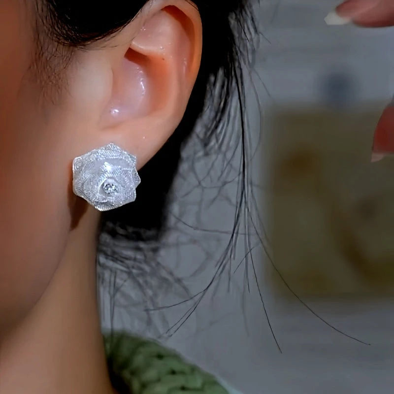 Close-up detail of the sparkling zircons and plating on the Diamond Rose Studs