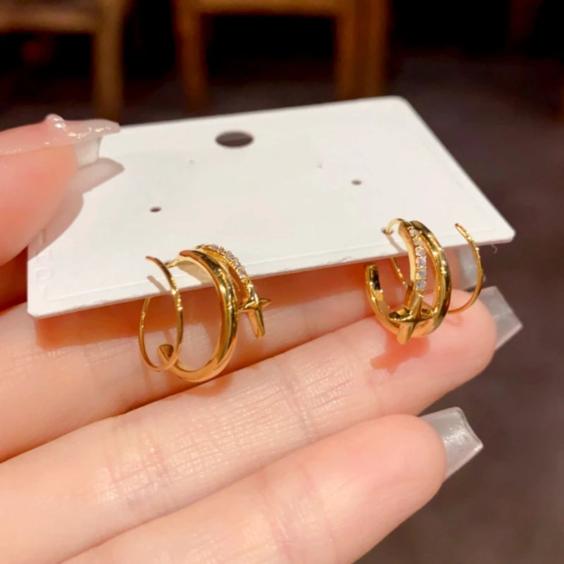 Close-up detail of the sparkling zircons and plating on the Star Threader Earrings