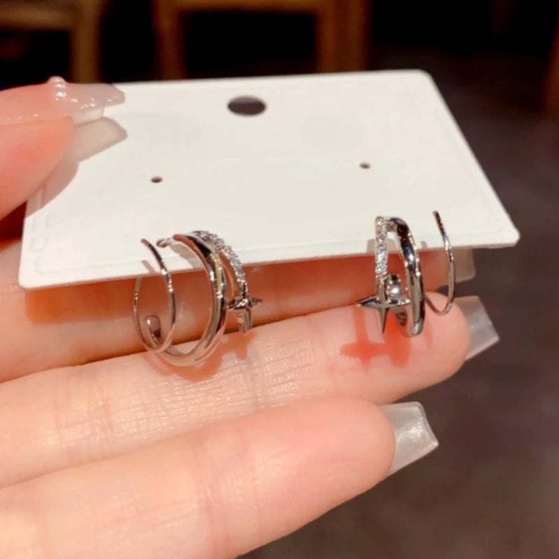 Model showcasing the dangle and style of the 14K Gold-Plated Elegant Diamond Star Threader Earrings