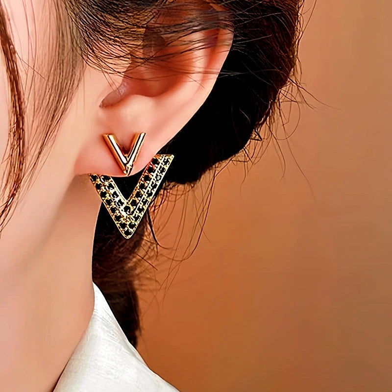 Close-up detail of the sparkling zircons and plating on the V Letter Ear Jackets