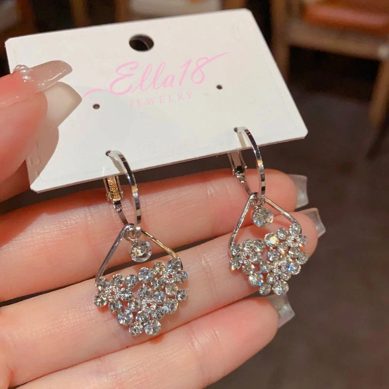 Angled view of the 14K Gold-Plated Elegant Diamond Water Drop Earrings