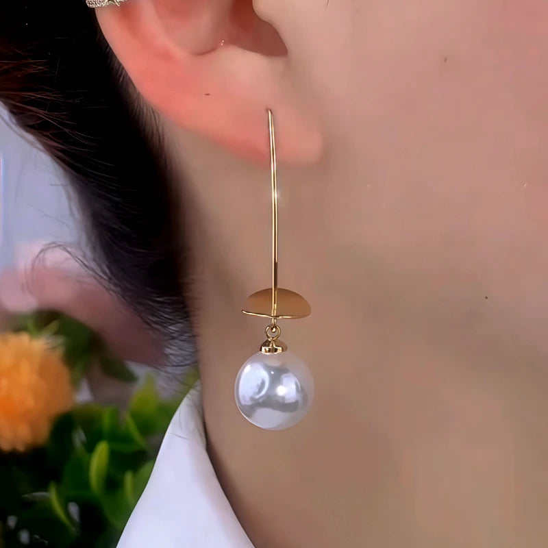 Close-up detail of the sparkling zircons and plating on the Pearl Ear Hooks