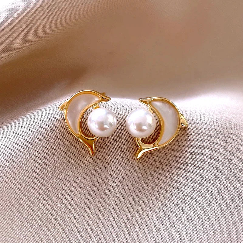 Close-up detail of the sparkling zircons and plating on the Dolphin Pearl Studs