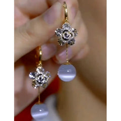 Close-up detail of the sparkling zircons and plating on the Flower Bead Earrings