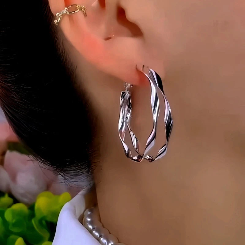 Angled view of the 14K Gold-Plated Elegant Double-Layer Hoop Earrings