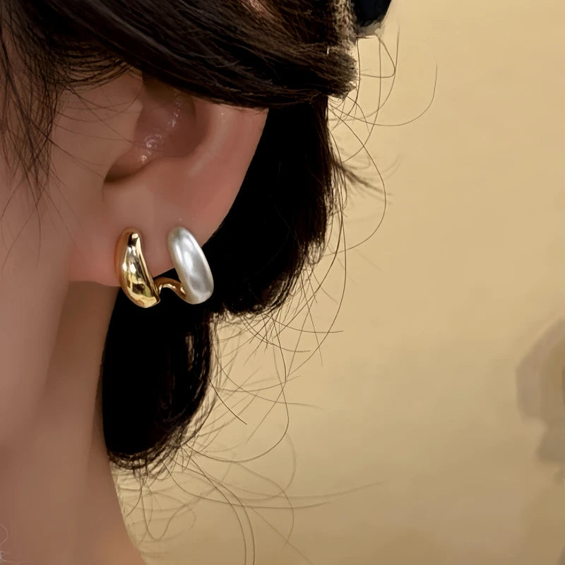 Model showcasing the dangle and style of the 14K Gold-Plated Elegant Double-Layer Stud Earrings