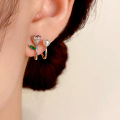 Model showcasing the dangle and style of the 14K Gold-Plated Elegant Double-Layer Zircon Rose Pearl Stud Earrings