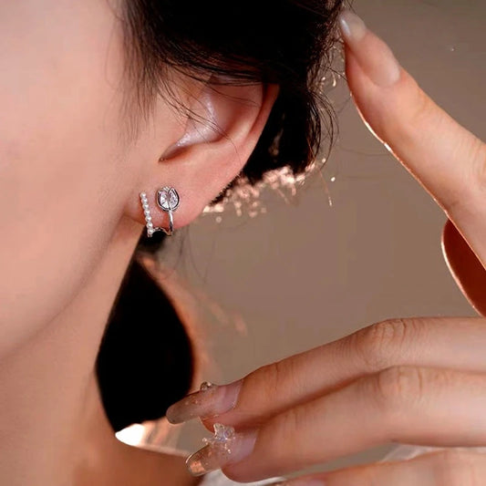 Model showcasing the dangle and style of the 14K Gold-Plated Elegant Double-Layer Zircon Tulip Flower Pearl Stud Earrings