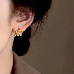 Model showcasing the dangle and style of the 14K Gold-Plated Elegant Double-Sided Five-Pointed Star Earrings