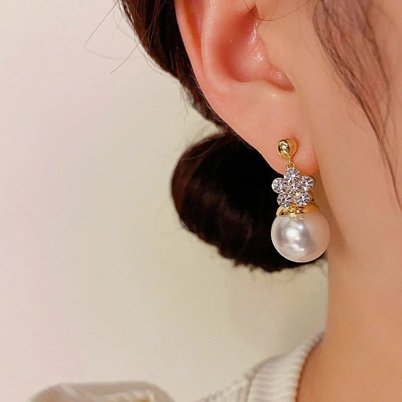 Close-up detail of the sparkling zircons and plating on the Double Sided Earrings