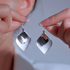 Angled view of the 14K Gold-Plated Elegant Double Leaf Ear Hook Earrings