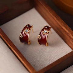 Angled view of the 14K Gold-Plated Elegant Enamel Flower Earrings