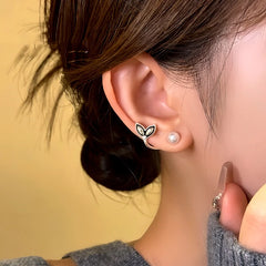 Close-up detail of the sparkling zircons and plating on the Fishtail Earrings