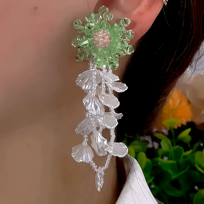 Angled view of the 14K Gold-Plated Elegant Flower Beaded Tassel Earrings