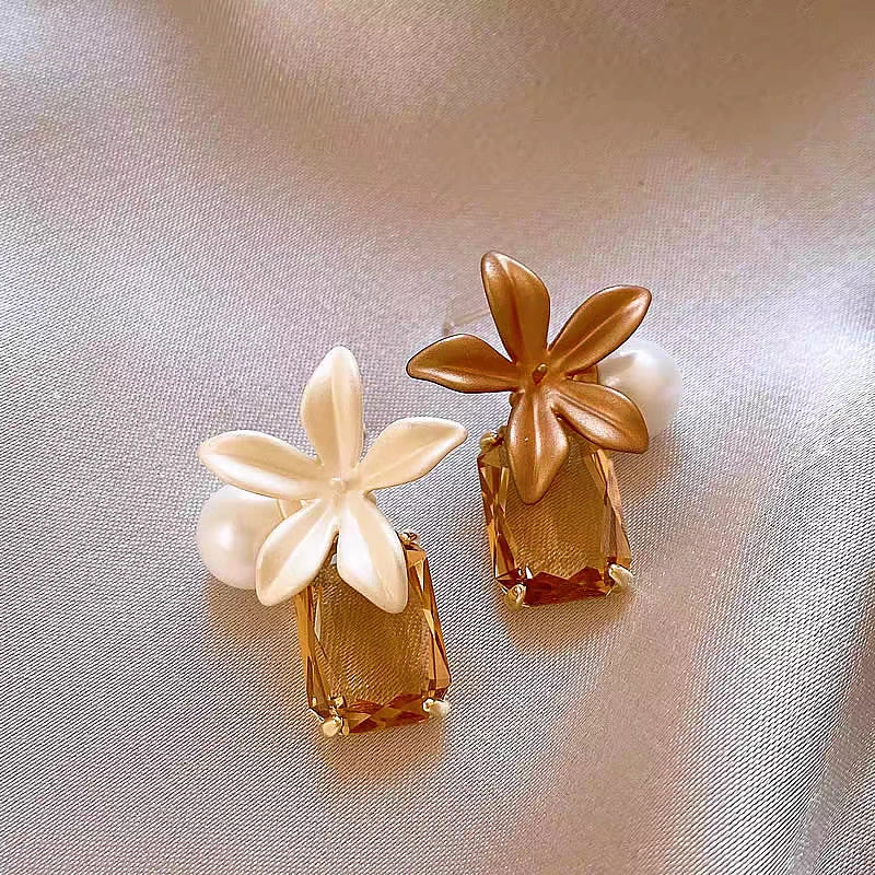 Angled view of the 14K Gold-Plated Elegant Flower Pearl Crystal Earrings
