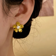 Close-up detail of the sparkling zircons and plating on the Flower Pearl Studs