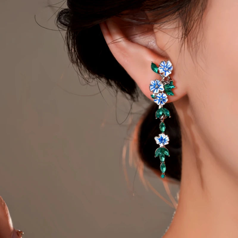 Angled view of the 14K Gold-Plated Elegant Flower Tassel Earrings