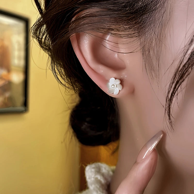 Close-up detail of the sparkling zircons and plating on the Pearl Jacket Earrings
