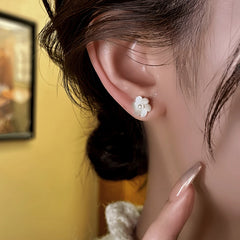 Close-up detail of the sparkling zircons and plating on the Pearl Jacket Earrings