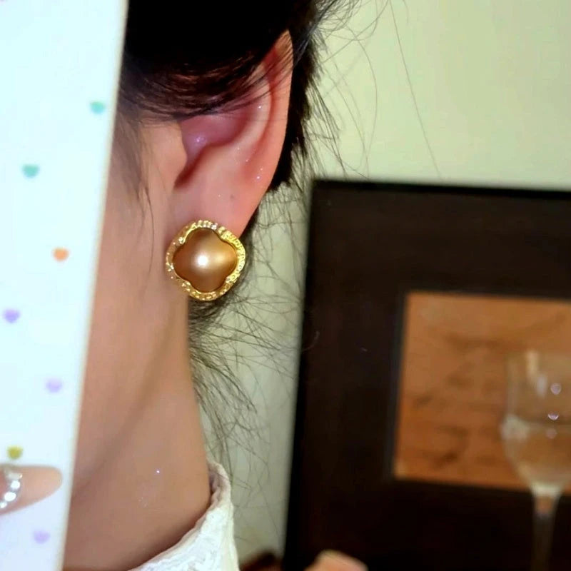 Close-up detail of the sparkling zircons and plating on the Four-Leaf Clover Studs