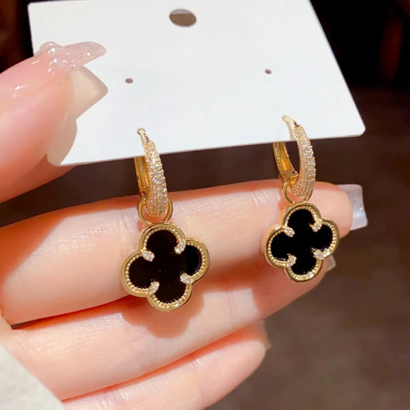 Close-up detail of the sparkling zircons and plating on the Black Clover Earrings