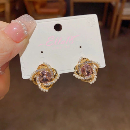 Model showcasing the dangle and style of the 14K Gold-Plated Elegant Fragrant Zircon Pearl Stud Earrings