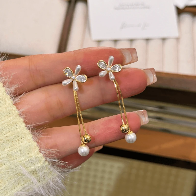 Angled view of the 14K Gold-Plated Elegant French Flower Tassel Earrings