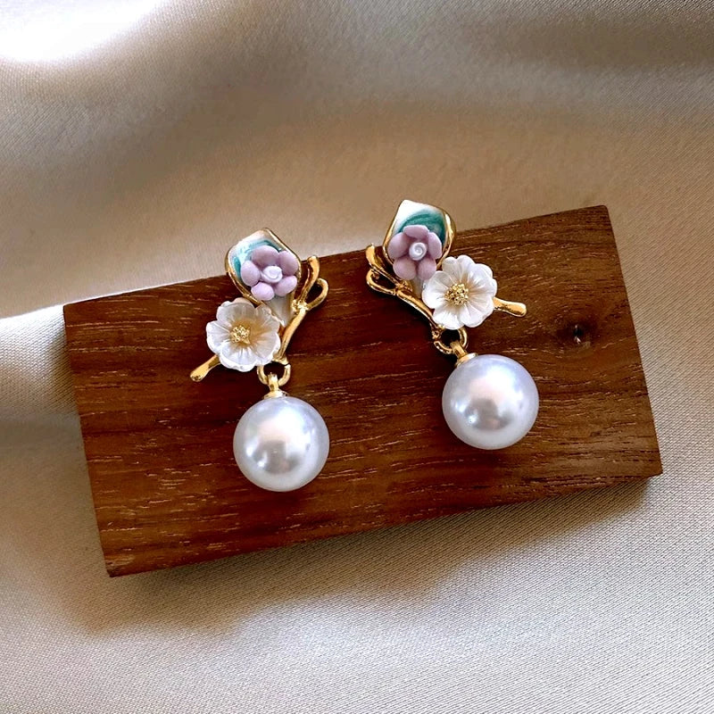 Angled view of the 14K Gold-Plated Elegant Fresh Flower Pearl Earrings